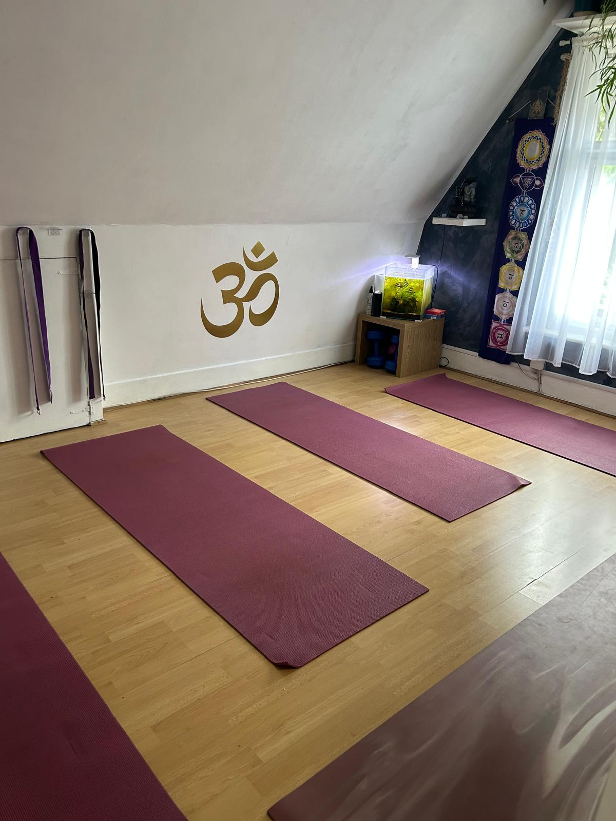 Studio interior with mats arranged for a calm practice